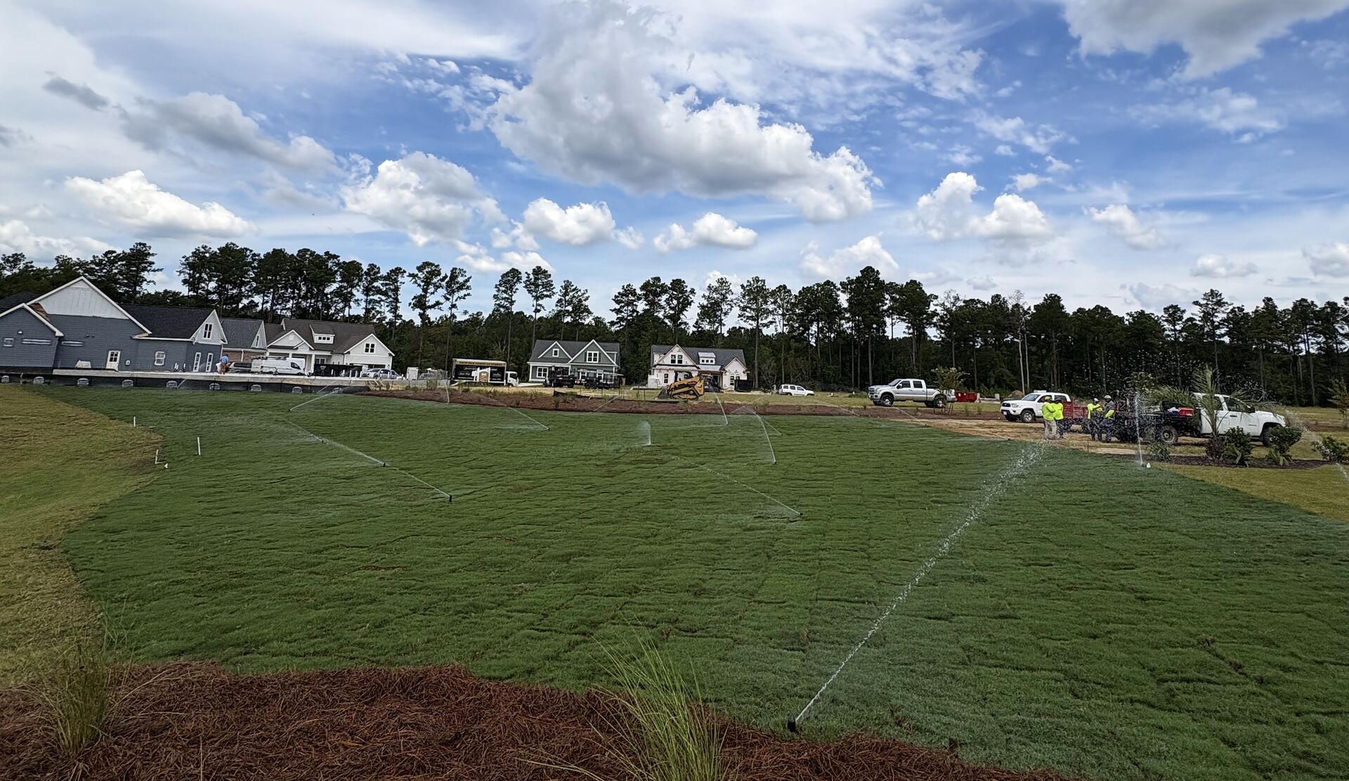 Irrigation running on a freshly sodded lawn installed by JP Landscapes